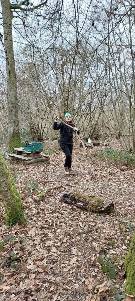 Avril safely carrying coppiced branch